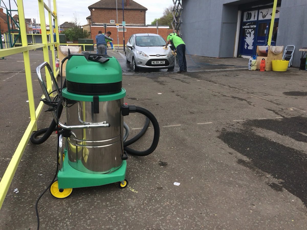 A silver Ford Fiesta being jet-washed and hand-cleaned by the Pit Stop team on Ley Street, Newbury Park.